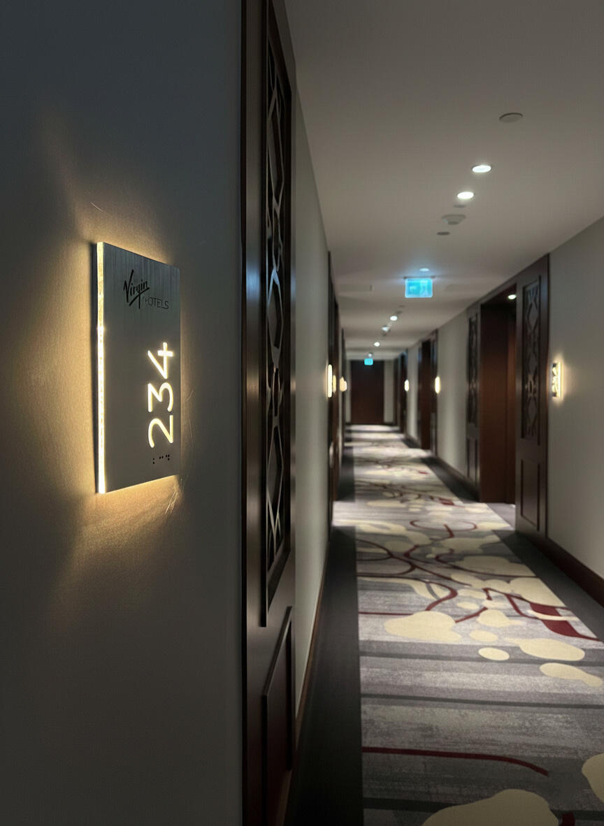 Contemporary hotel room sign featuring logo and ADA compliant Braille LED hotel room number display with ADA compliant Braille and logo