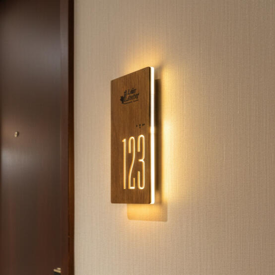 Luxury illuminated room sign with ADA compliant Braille and logo design Luxury hotel room number sign with ADA compliant Braille and corporate branding